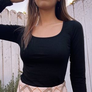 black long sleeve top with a u neck line